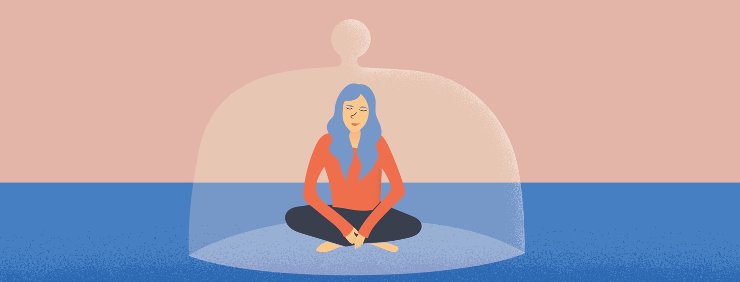 A woman sits happily underneath a protective casing