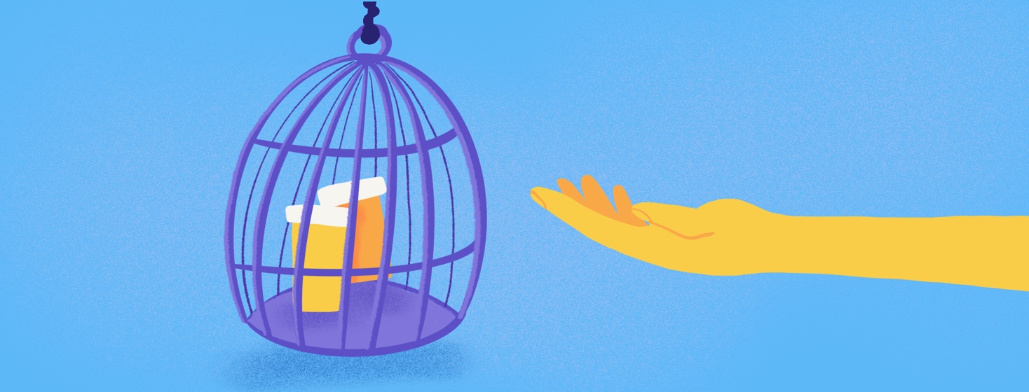 A hand reaches out for medication that is locked in a cage that has no door