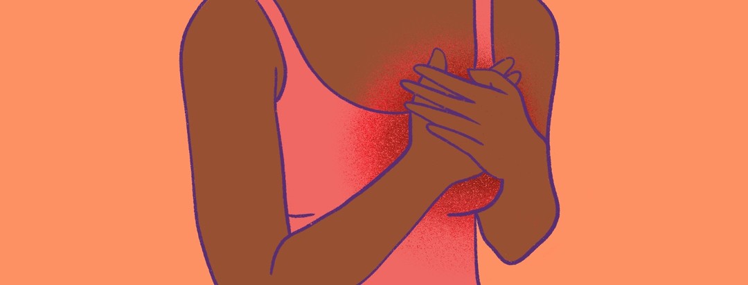 A woman clutches her breast which has pain/inflammation radiating out of it