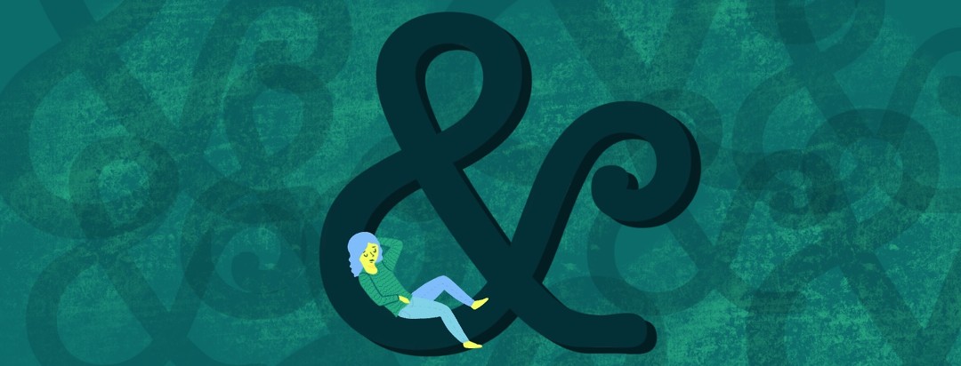 A woman reclines on a giant ampersand