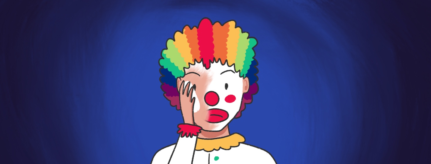 A clown removes their makeup with a slightly sad expression