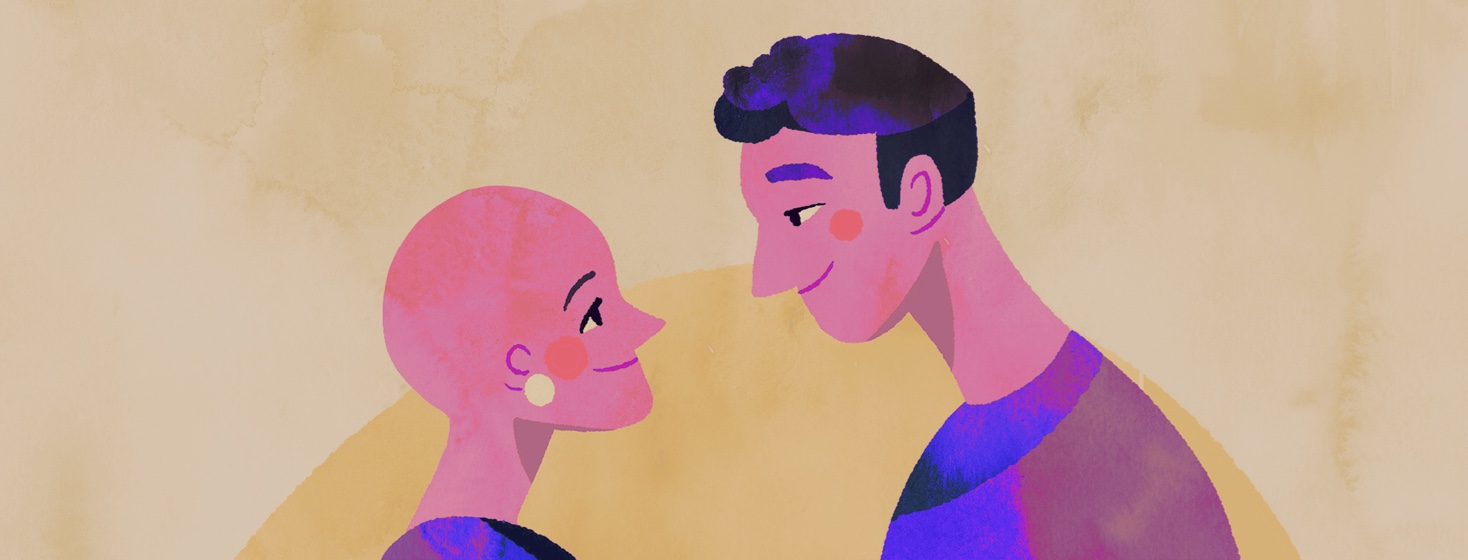 A woman with no hair and a man look lovingly into each others eyes