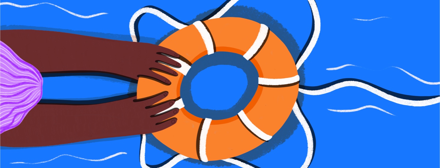 A person in the water grabs onto a life preserver