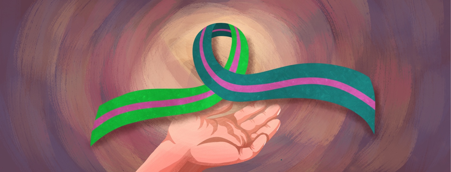 A hand holds up the metastatic breast cancer awareness ribbon - a green, teal and pink ribbon