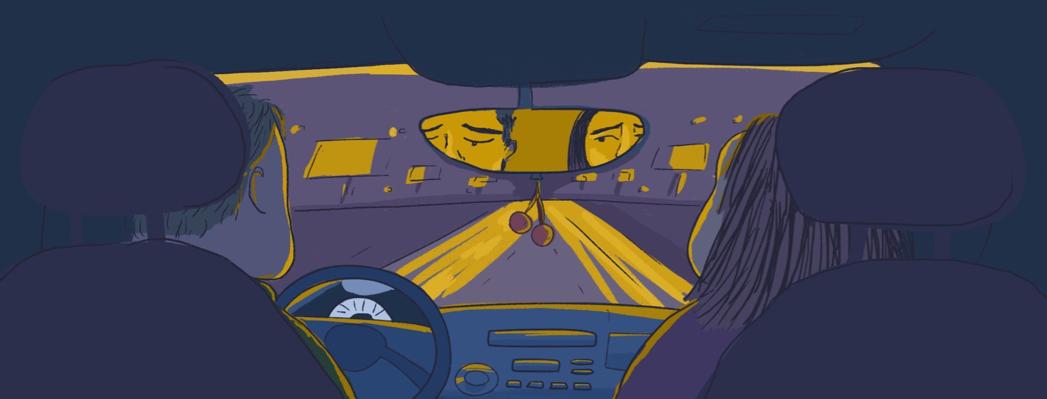 Couple driving and holding hands in a car at night, dark road, with a view of their sad concerned faces in the rearview mirror